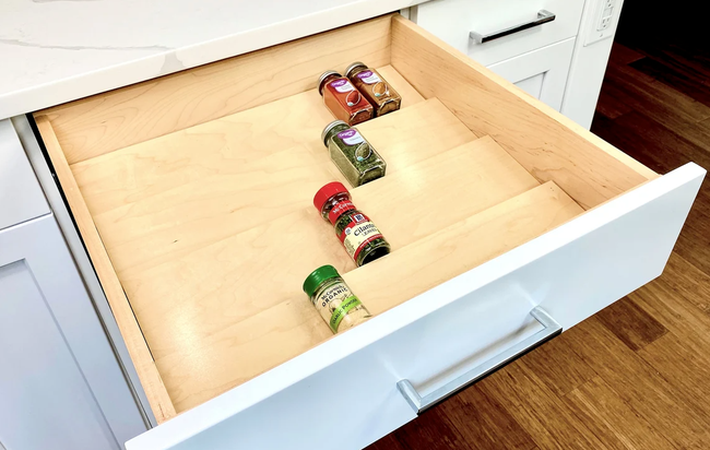 Spices neatly placed in an empty organizer, waiting to be filled.