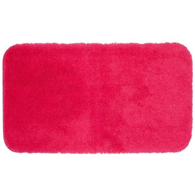 A straightforward, rectangular bath mat made from soft plush material in a single, solid color.