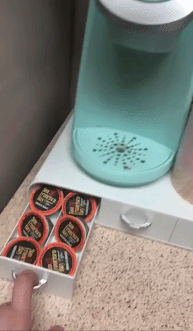 A GIF showing a reviewer opening the K-Cup storage drawer, highlighting its smooth functionality.