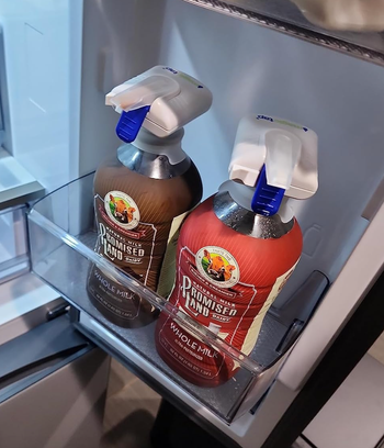 Two bottles of milk equipped with Magic Tap dispensers