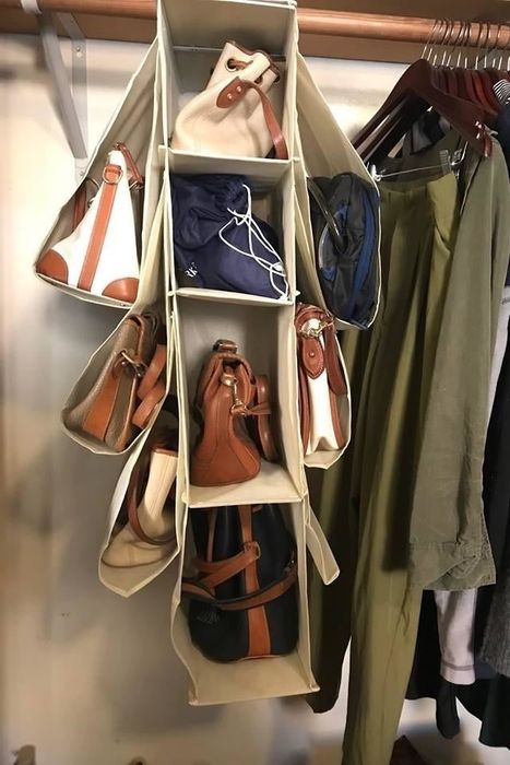 A reviewer shares a photo of their bag organizer neatly stored in their closet, showing its practicality.