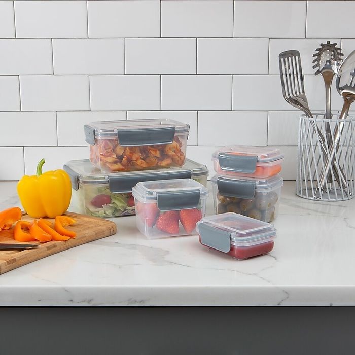 The food containers filled with food, neatly arranged on a kitchen countertop