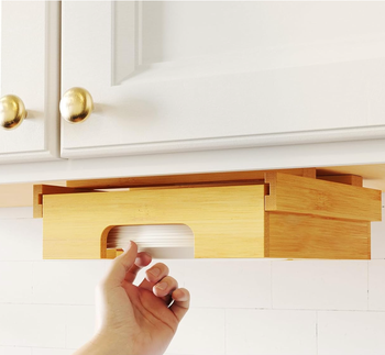 A model is taking a plate out of an organizer.