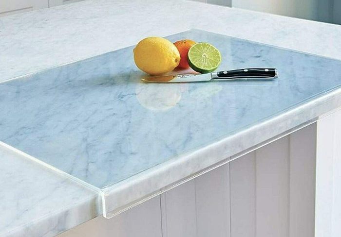 The clear cutting board displayed in use