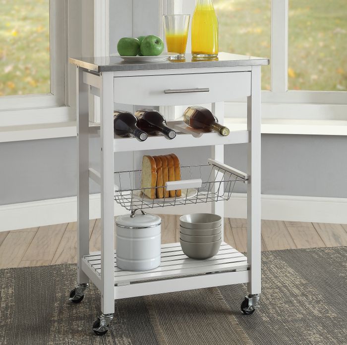 The white rolling kitchen cart in use.