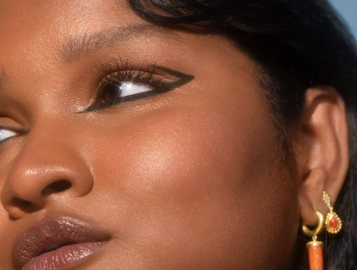 Model showcasing the bold look created with the black eyeliner.