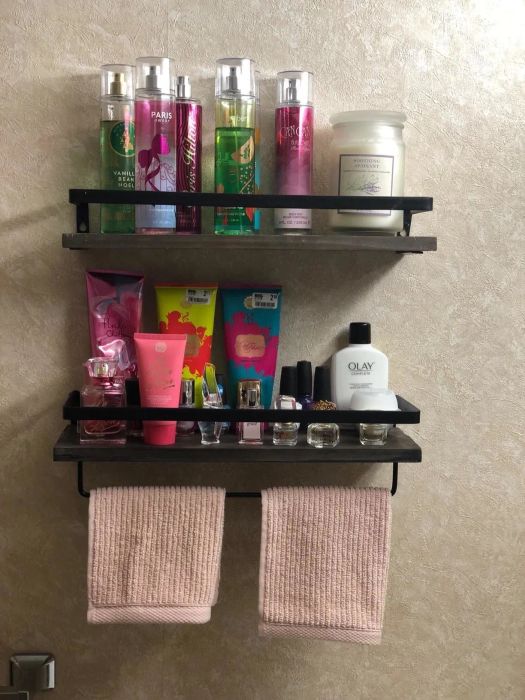 A reviewer’s photo of a shelf that features a built-in towel rack.