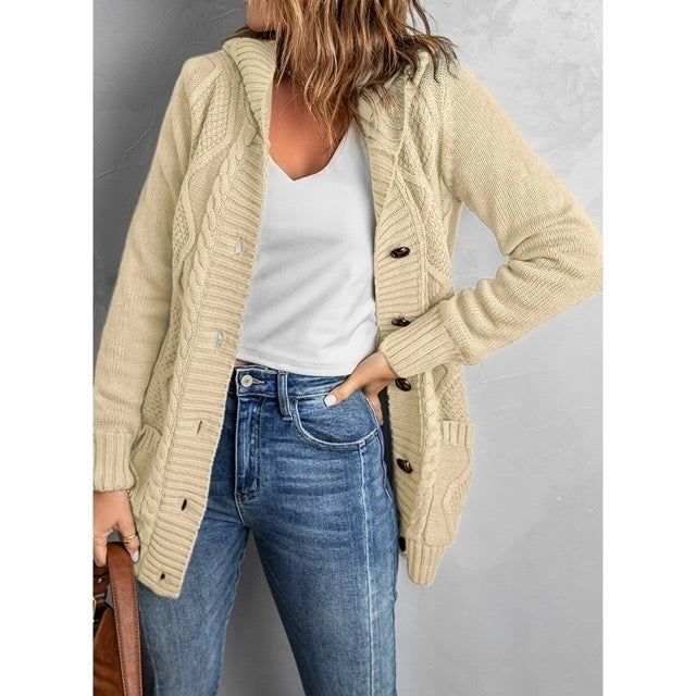 A person is wearing the cardigan in a soft beige shade, showcasing its versatility and cozy design.