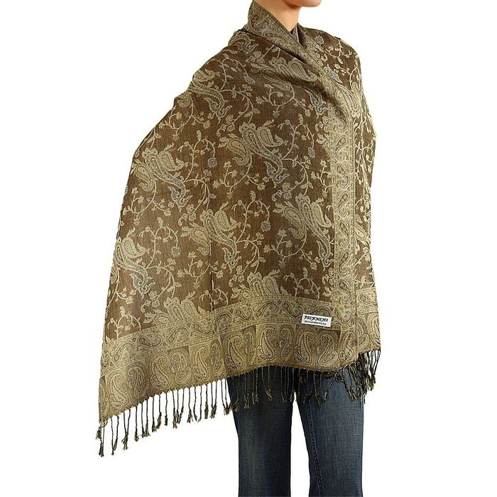 A model is showcasing a vibrant green scarf, adding a pop of color to their outfit.