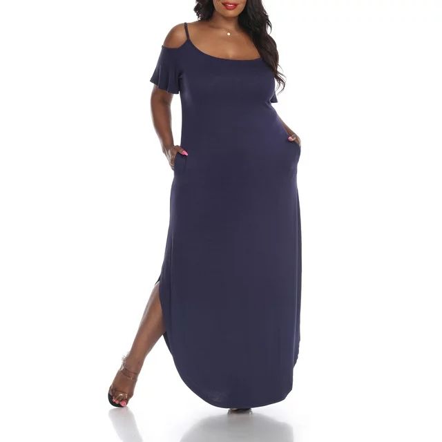 A model is wearing a chic maternity dress with an off-shoulder design and a side slit for a modern, elegant look.