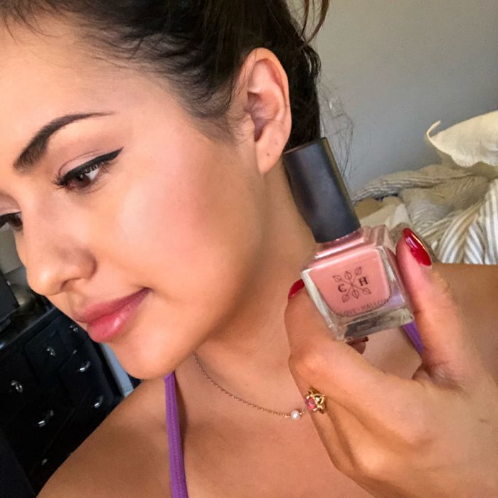 Writer Kayla Suazo applying the blush on her cheeks.