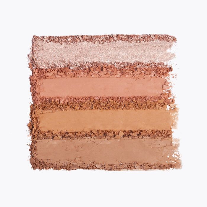 Swatches of the highlighter, blush, bronzer, and contour powders from the palette.