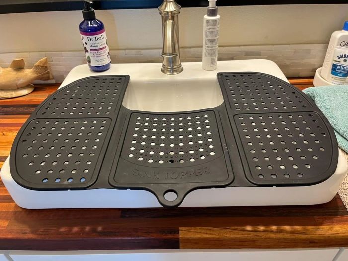 A folding tray that fits neatly over your sink
