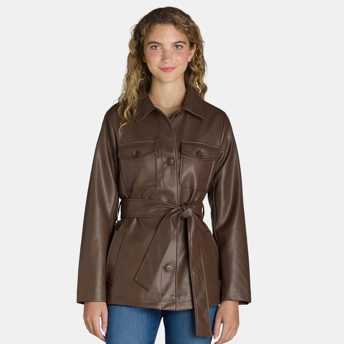 A model wearing a brown jacket.