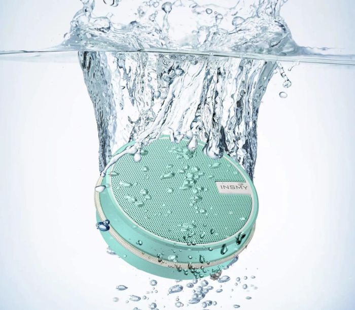 A photo of the blue speaker completely submerged in water.