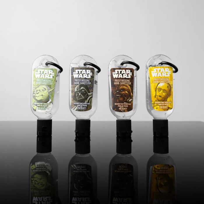 A set of mini hand sanitizers, each with a convenient keychain loop for easy carrying.