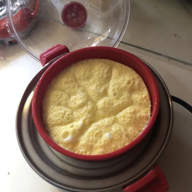 A reviewer's omelette being cooked in the egg maker.