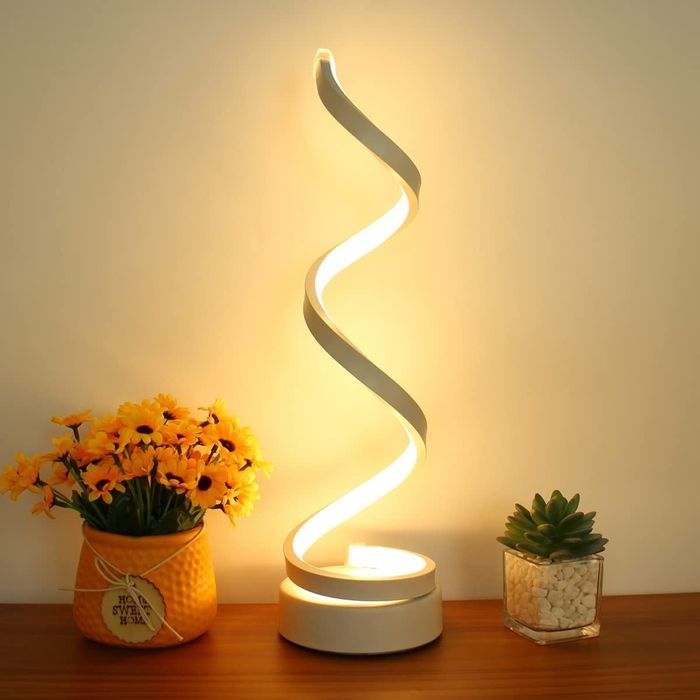 The lamp glowing in a soft warm light setting.