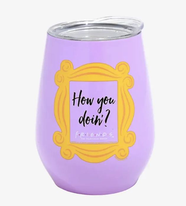 A purple tumbler featuring a frame with the phrase