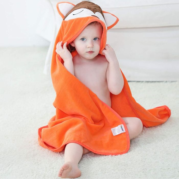 A baby wrapped in the adorable fox towel