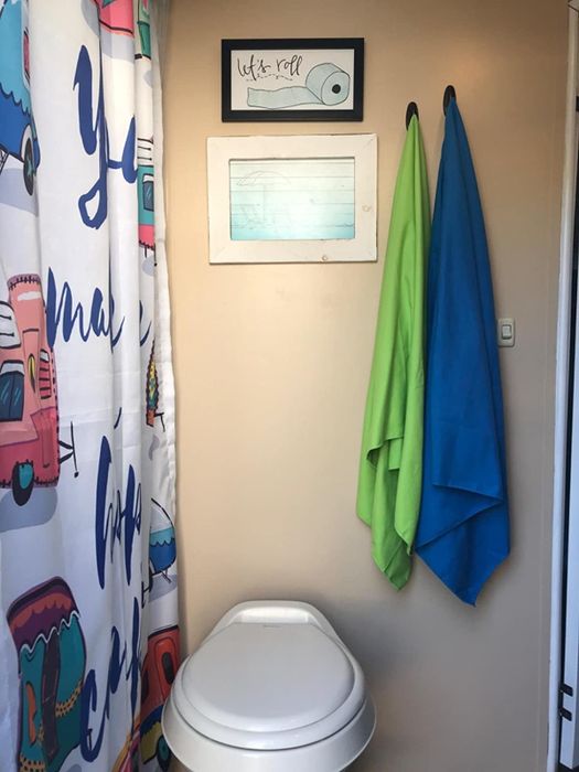 The green and blue towels neatly arranged in a bathroom