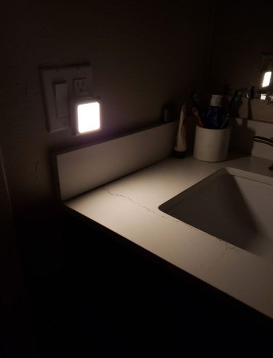 The nightlight in a dimly lit bathroom.