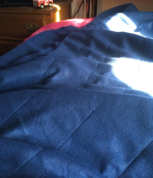 A reviewer image featuring a blue blanket
