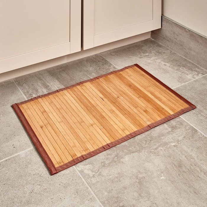 A bamboo mat placed in front of your cabinets to add a natural touch to your home.