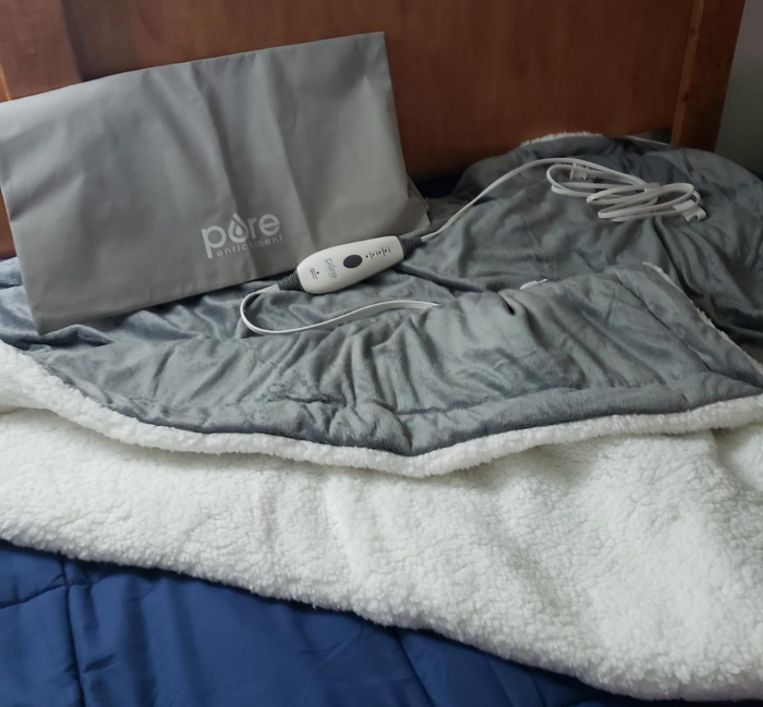 A reviewer image displaying a gray and white blanket