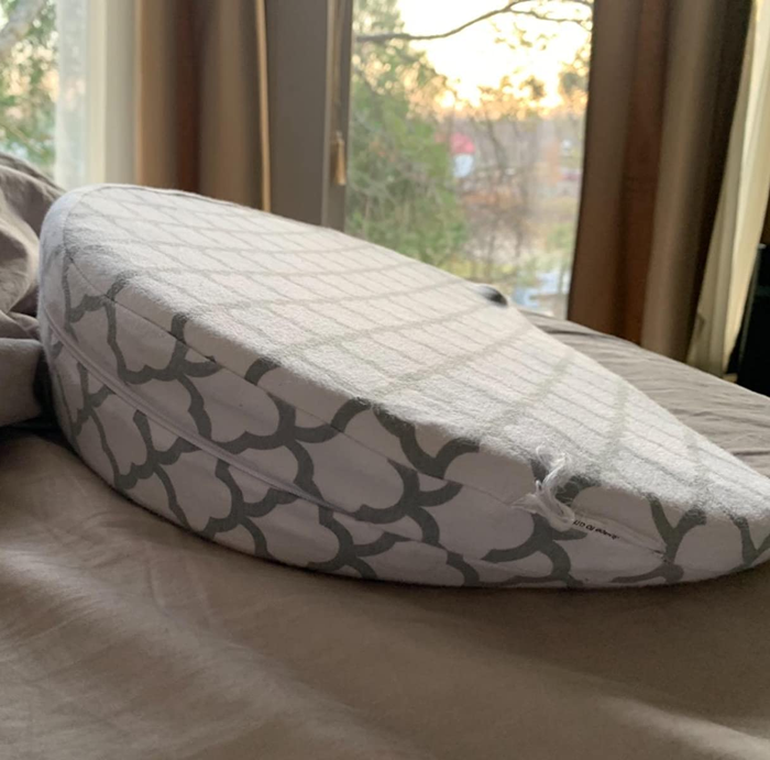 Reviewer image of the gray and white pregnancy wedge pillow