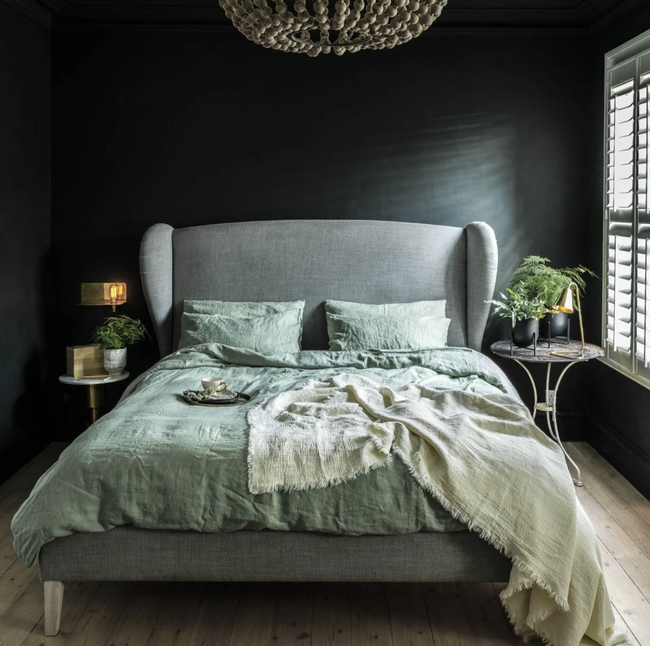 A bed featuring linen bedding