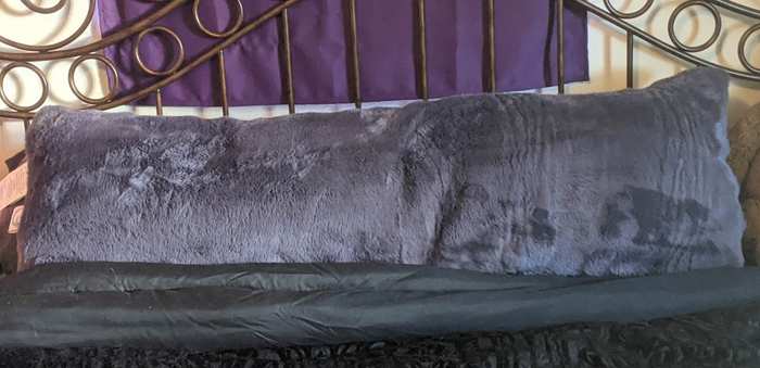 Reviewer's image of the purple faux fur pillow