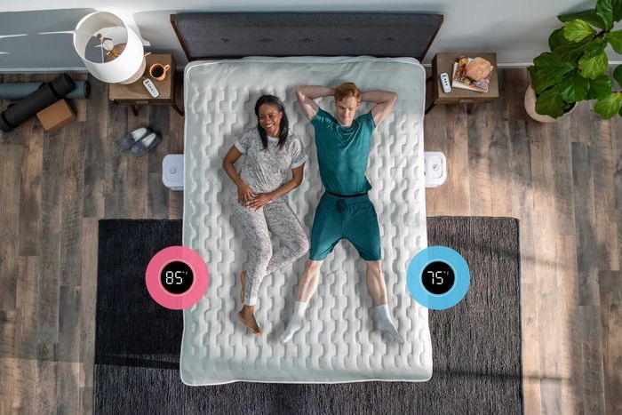A couple in bed, each experiencing a different temperature on their respective sides