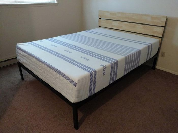 A Queen-sized mattress in a reviewer’s home, without sheets.