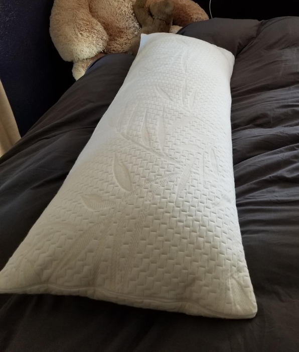 Reviewer photo of the white pillow placed on a bed