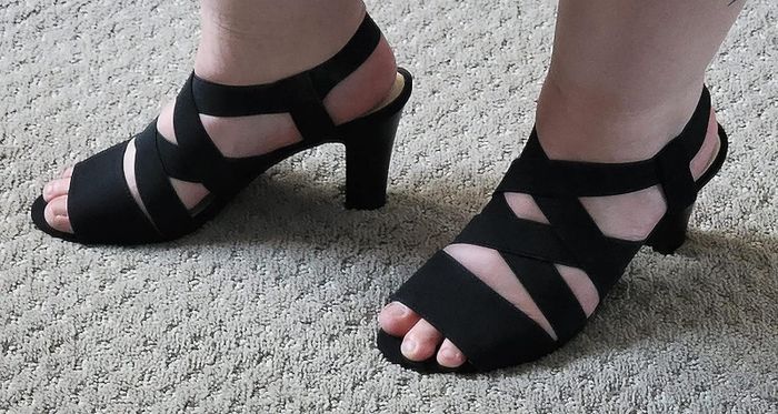 A reviewer shows off the shoes in their image.