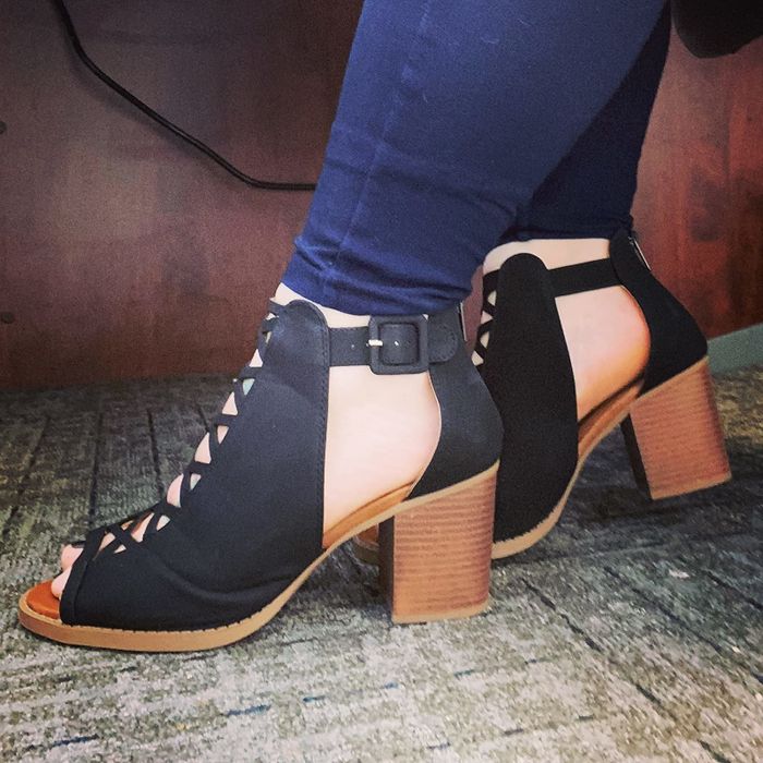 A reviewer is wearing the black heels.