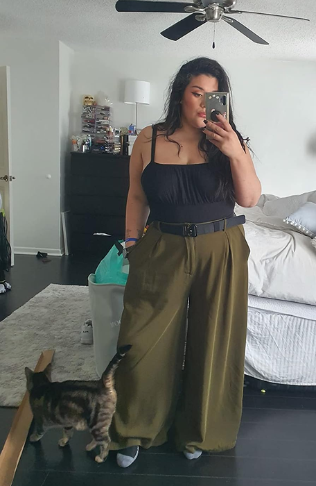A different reviewer is seen sporting green pants.
