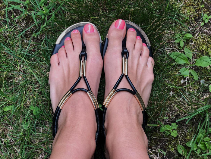 A reviewer is wearing the sandals in black.