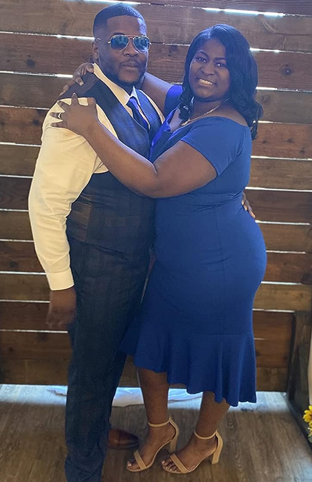 A reviewer is wearing the shoes in tan at a wedding reception.