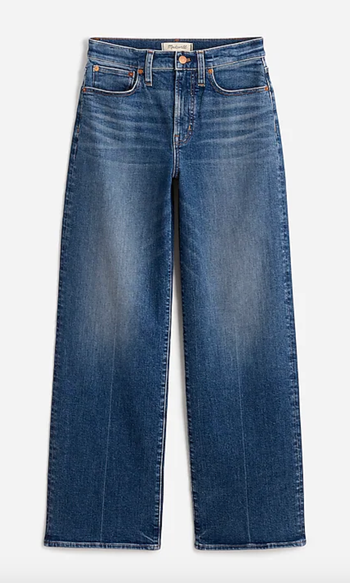 Wide-leg jeans with a high waist, featuring slightly faded denim, a classic five-pocket design, and a button fly closure.