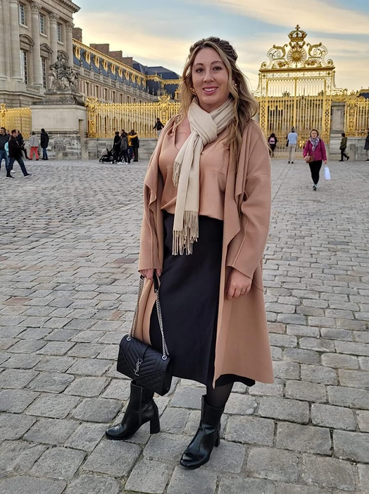 A reviewer is wearing the skirt in classic black.