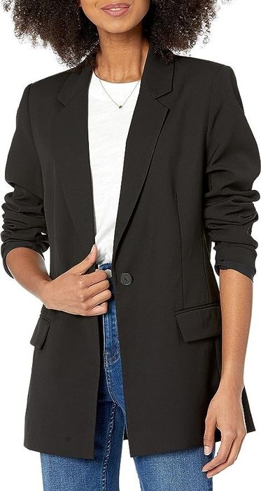 A model is wearing the blazer in black.