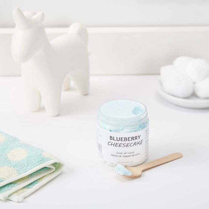 A jar of soap resting on a bathroom counter.