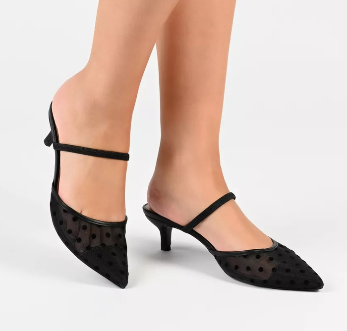 A model is seen wearing the shoes in black.
