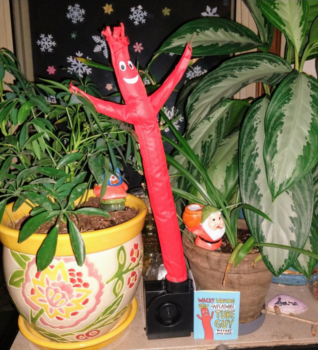 A reviewer's tiny red inflatable tube man