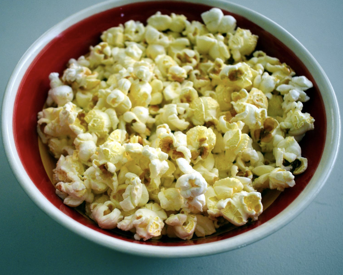 A photo of buttery, golden popcorn.