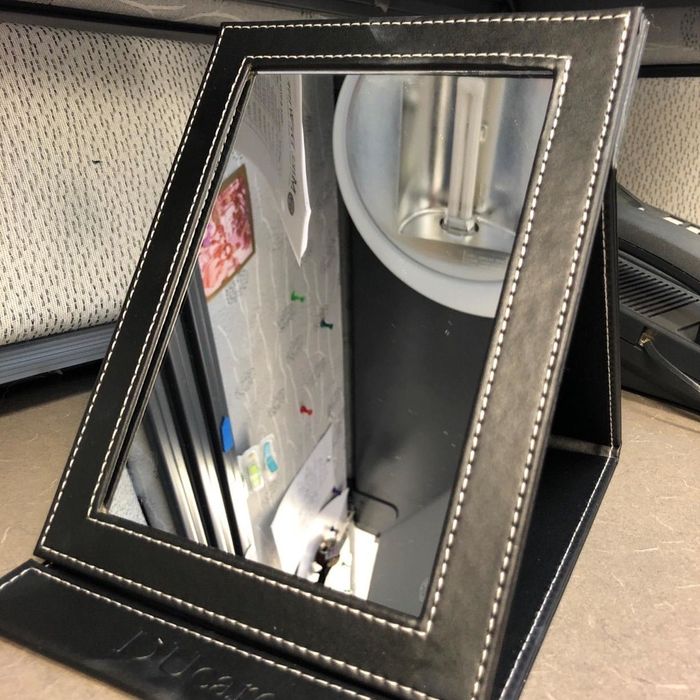 The desk mirror itself.