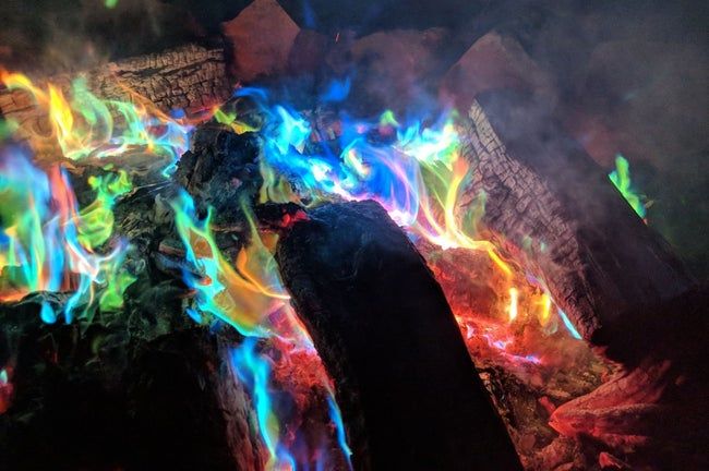 A campfire with colorful, rainbow-like flames.