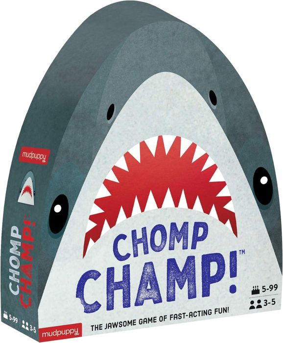 The front packaging of the game 'Chomp Champ!' by Mudpuppy, featuring a playful shark design and details about the recommended player age range (5-99) and the number of players (3-5)